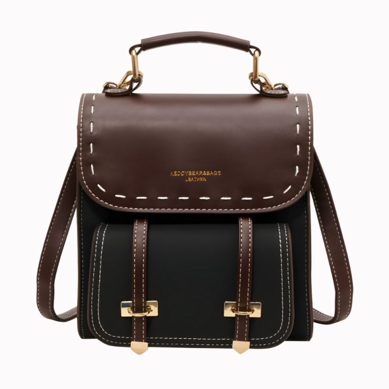 Petit sac à dos vintage noir et marron avec un fond blanc