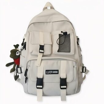 Sac à dos de voyage tendance blanc avec une peluche suspendue. Bonne qualité et très à la mode.
