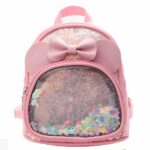 Petit sac à dos fille avec noeud rose avec un fond blanc
