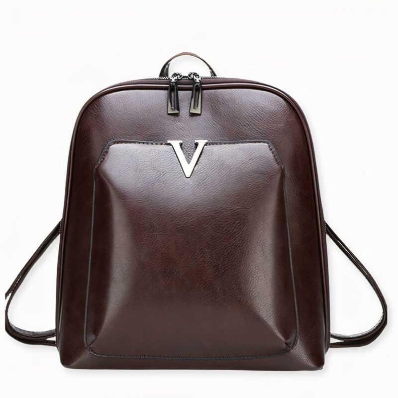 Petit sac à dos vintage V en version noir, sur fond gris clair.