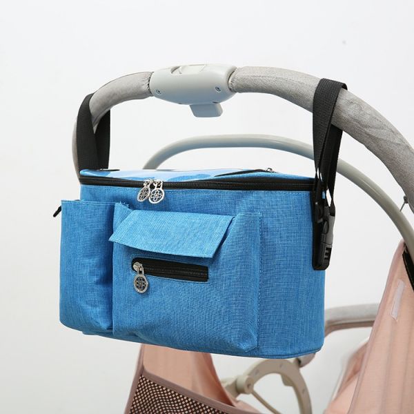 Sac de rangement accessoire pour poussette bébé bleu avec un fond une poussette