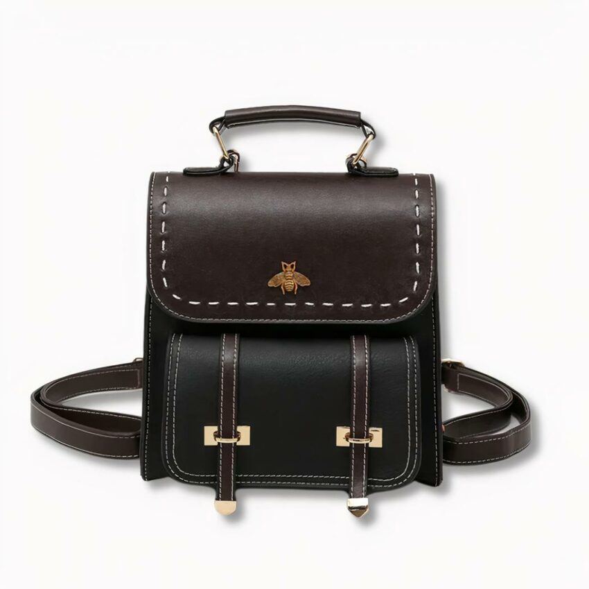 Sac à dos cartable noir pour femme avec un motif d'abeille sur le devant, sur fond gris clair